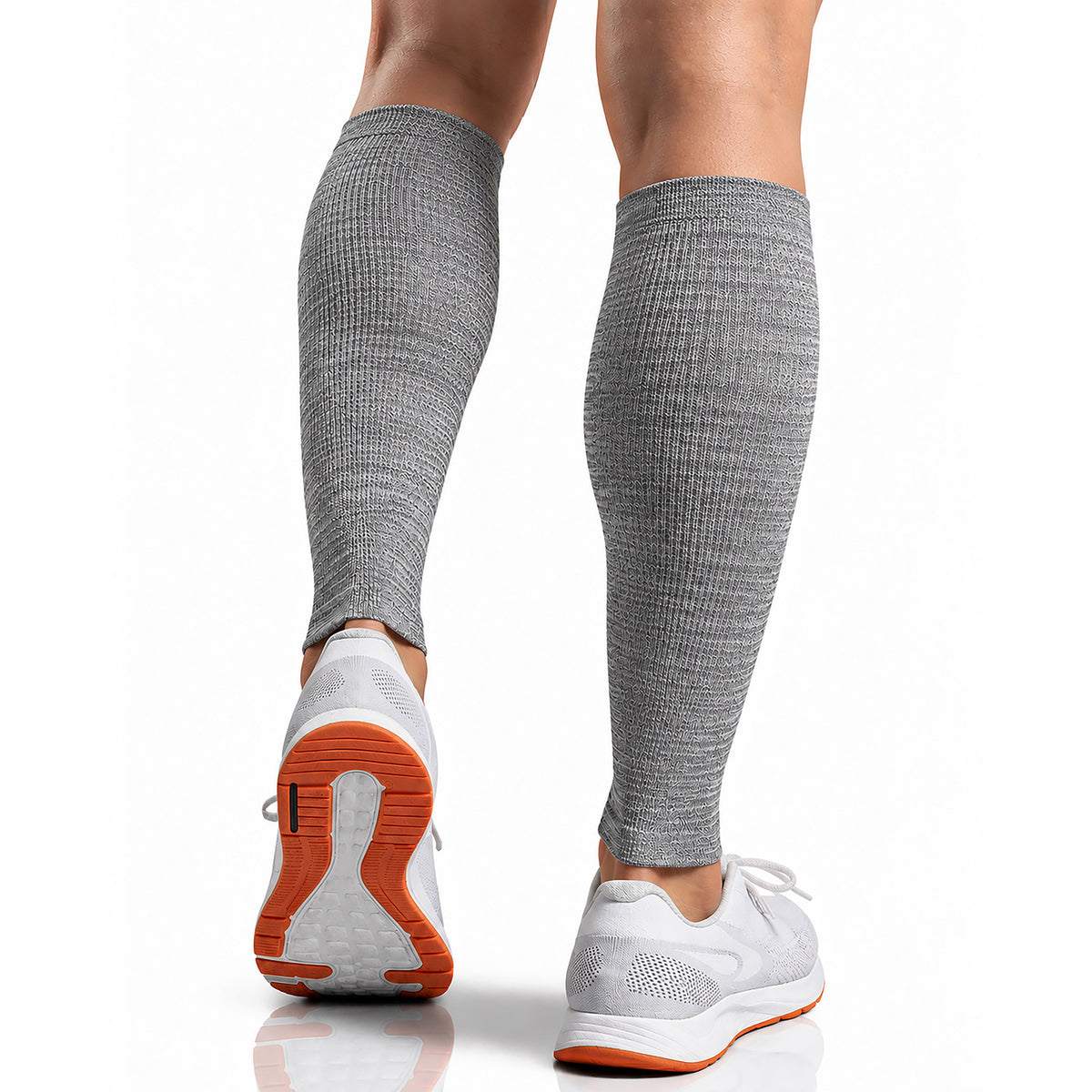 Gray knee-high compression sleeves worn on a person's legs, shown from the back and side against a clean white background.
